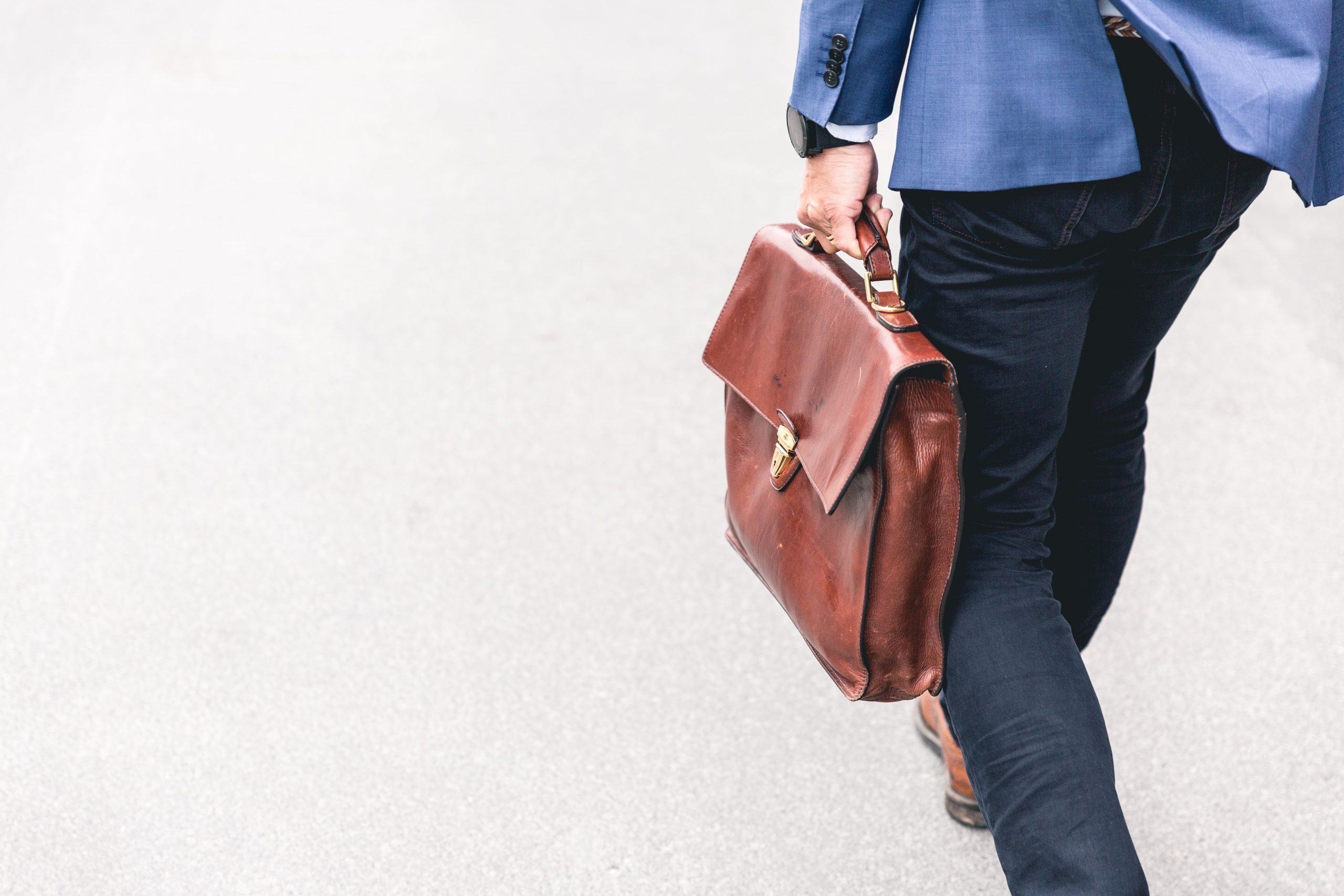 banking and insurance man walking with briefcase