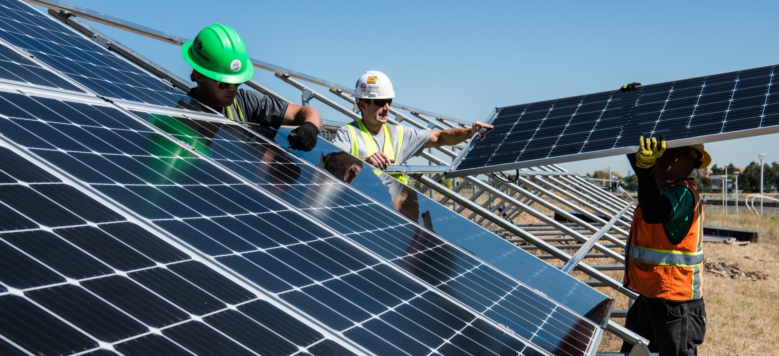 utilities solar panels workers
