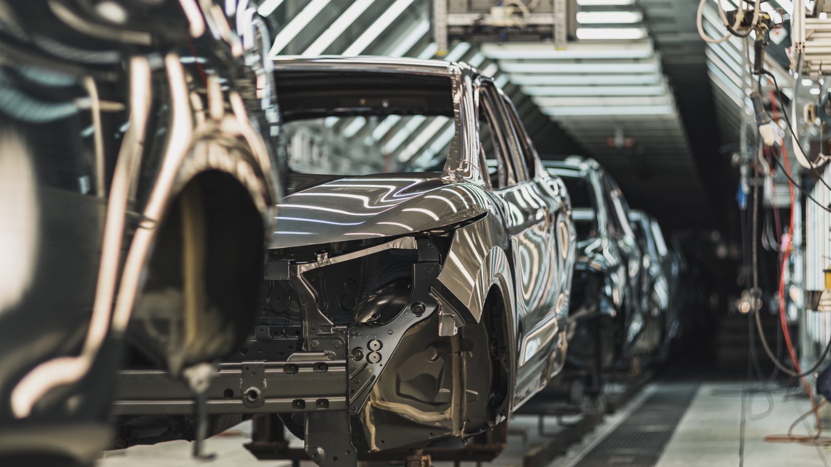 Automotive production line with connected manufacturing systems in a modern factory