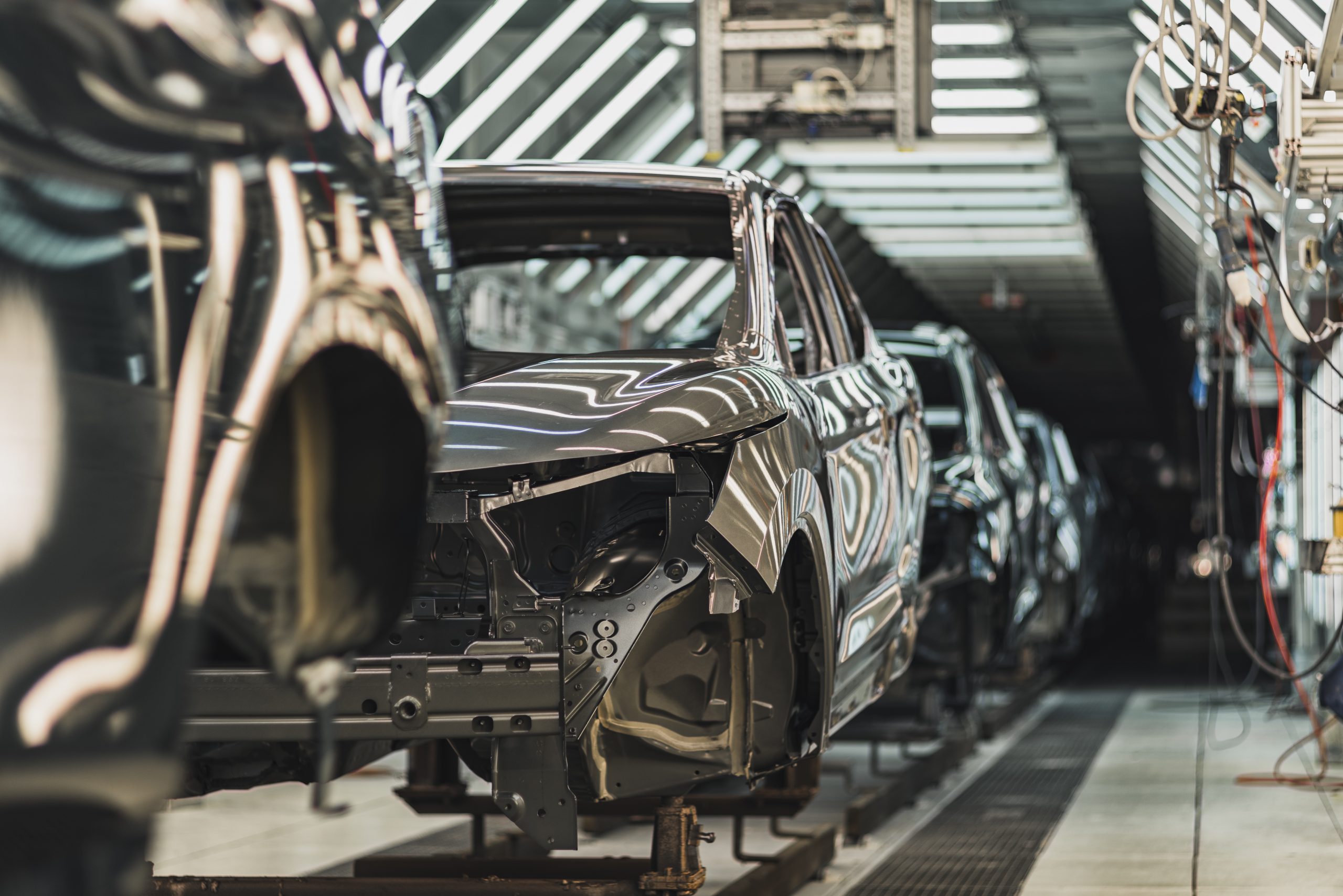 Automotive production line with connected manufacturing systems in a modern factory