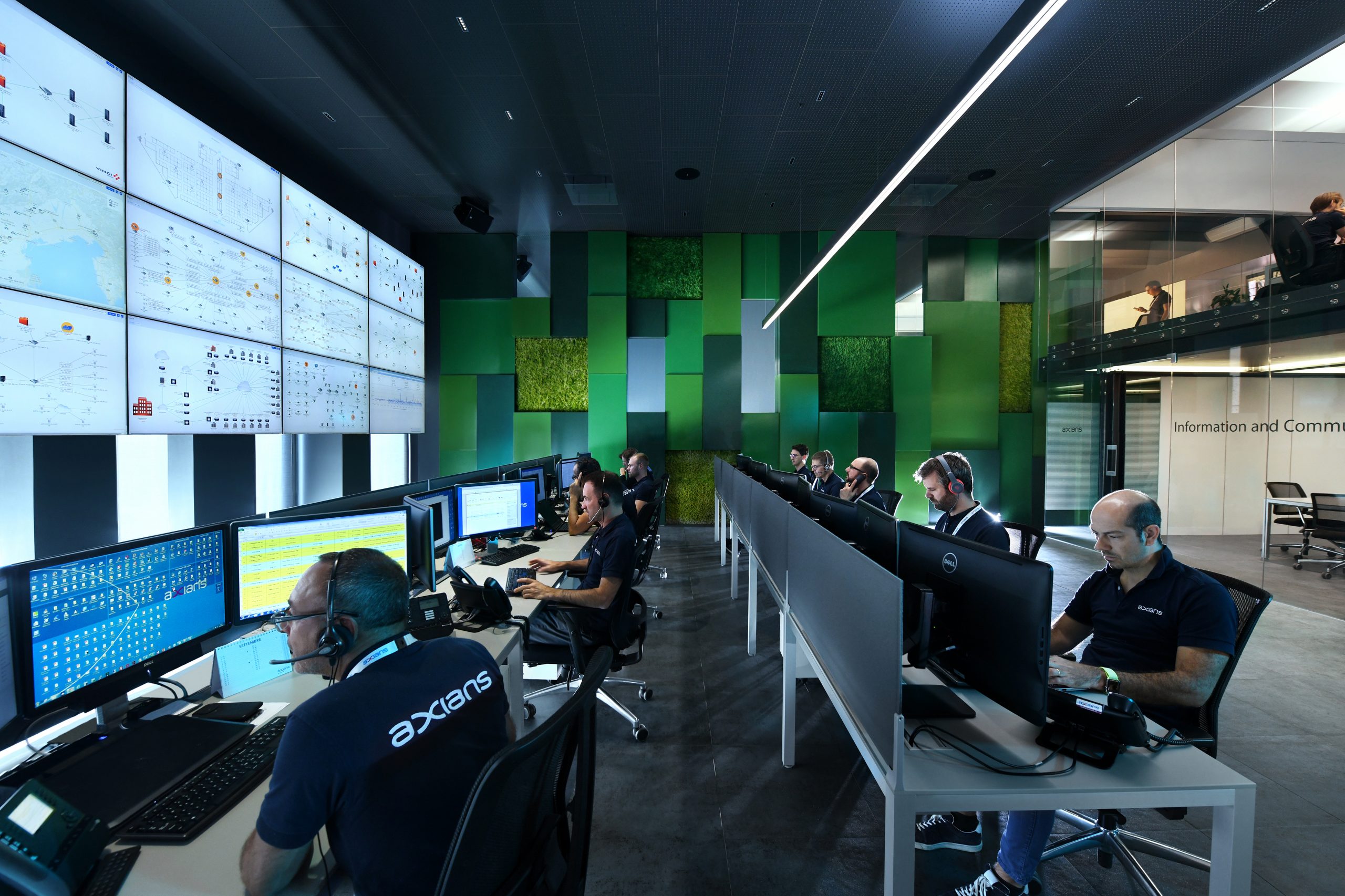 Security operations centre with analysts monitoring critical infrastructure and cybersecurity systems in a modern command environment.