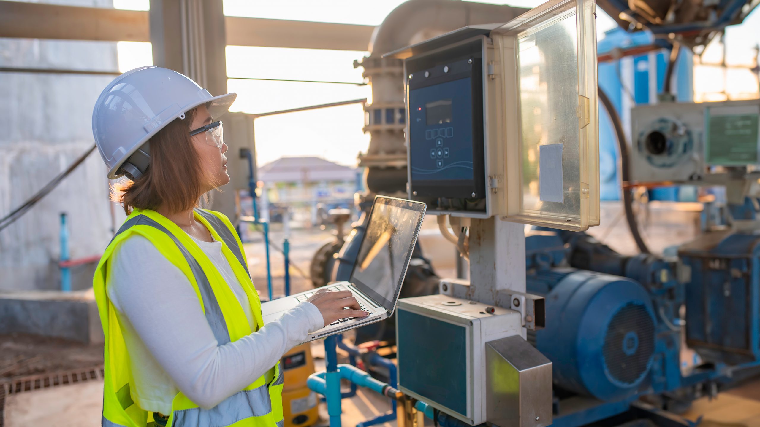 Engineer monitoring waste management system via digital interface