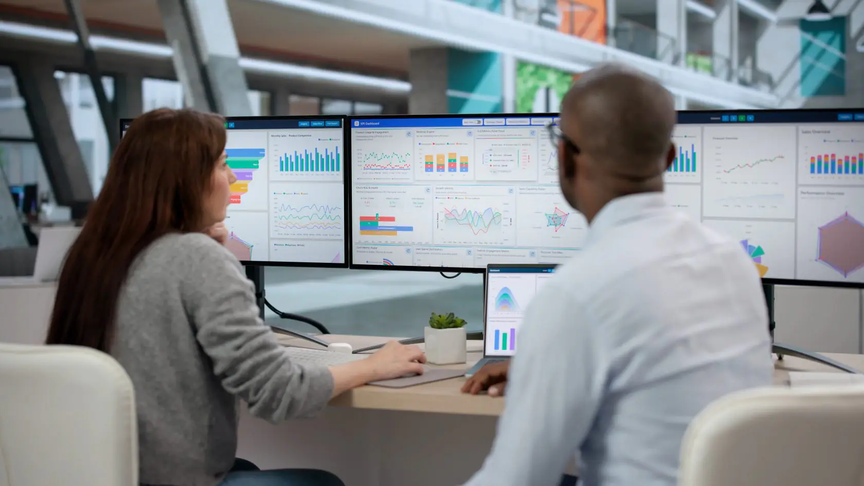 Business team analyzing enterprise performance dashboards during an SAP transformation project.