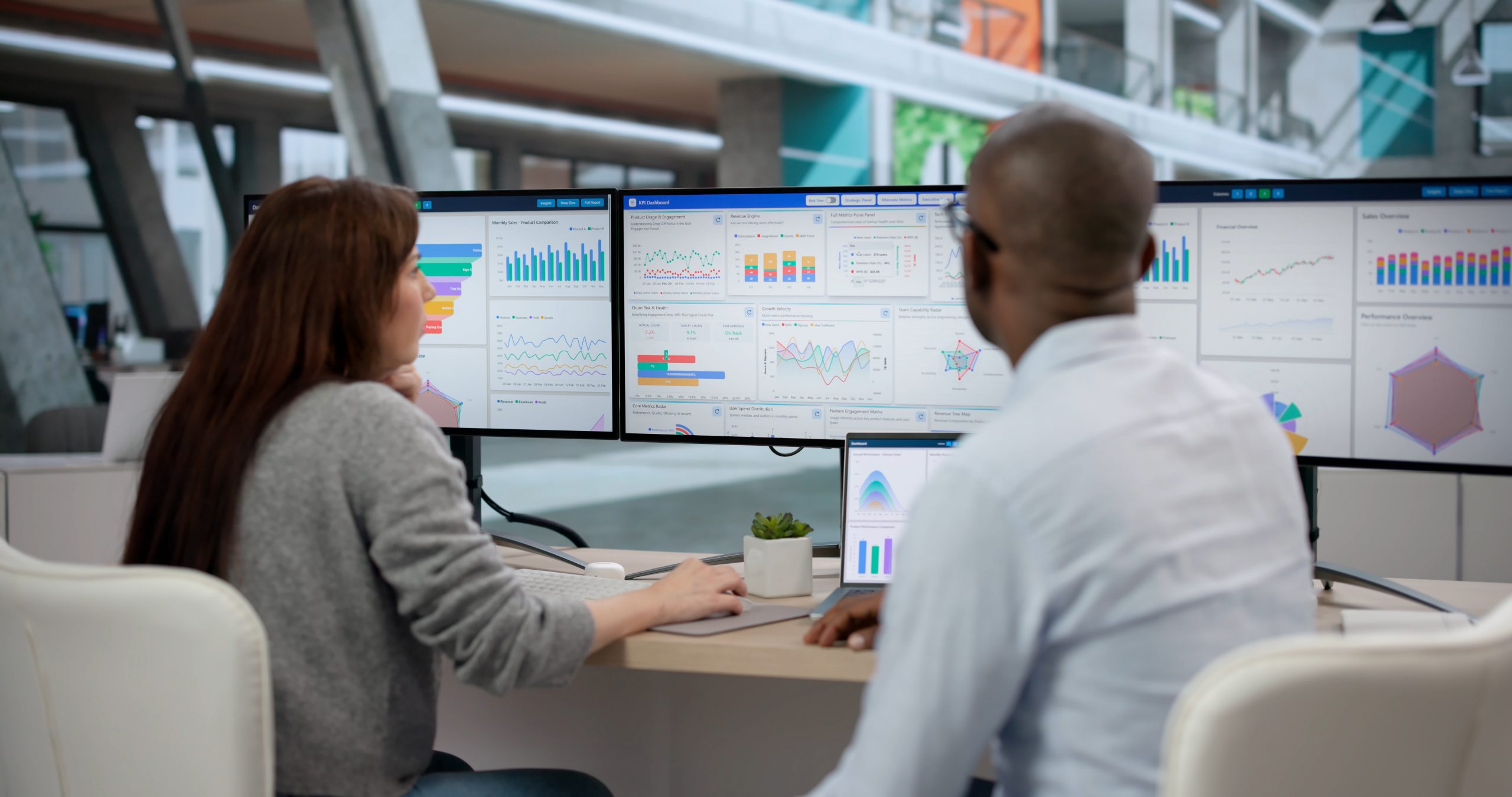 Business team analyzing enterprise performance dashboards during an SAP transformation project.