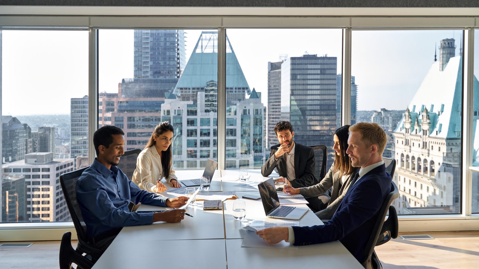 Banking and insurance professionals meeting to discuss digital transformation initiatives.