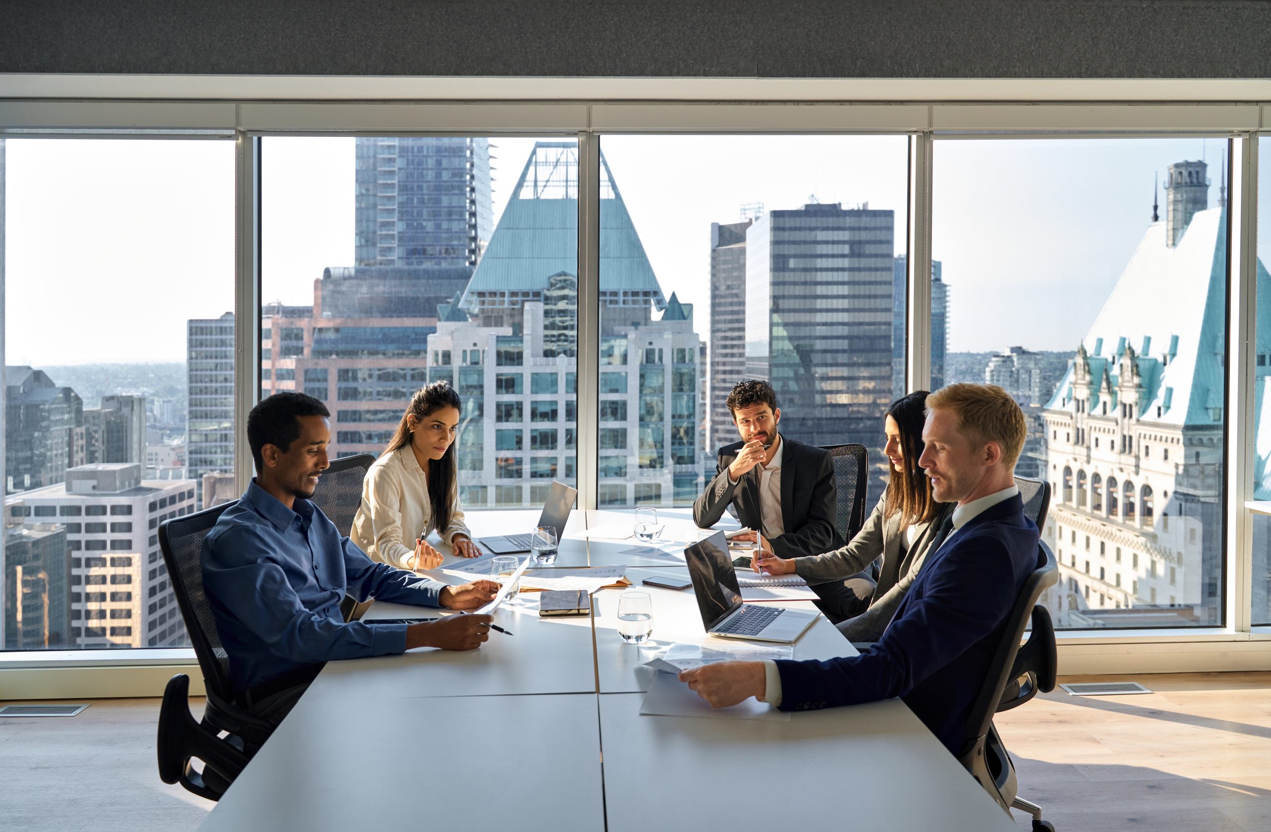 Banking and insurance professionals meeting to discuss digital transformation initiatives.