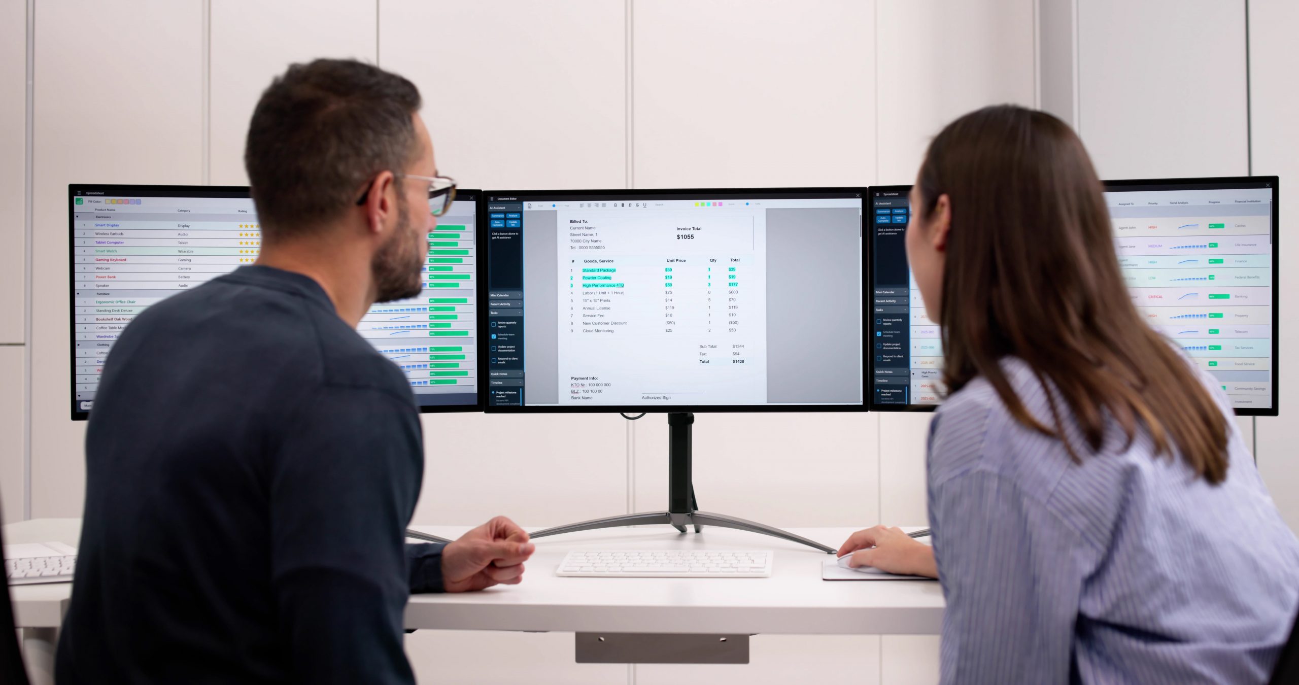 Two professionals reviewing project evaluation data and digital assessment dashboards on multiple screens.