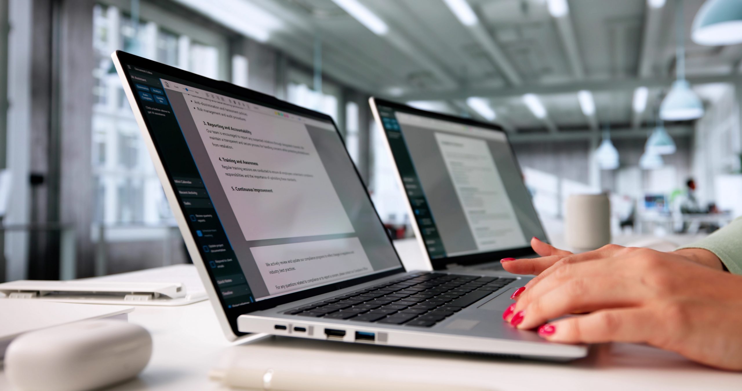 User reviewing AI-generated document summaries on a laptop.